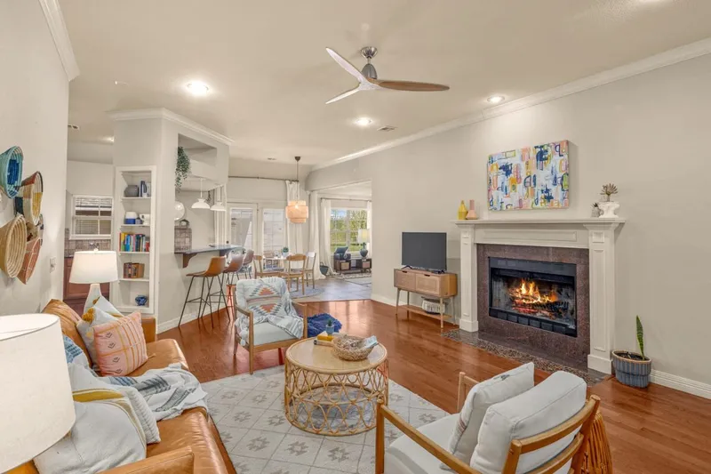 Professionally styled living room with fireplace in a Weekender-managed vacation rental in Fayetteville, Arkansas
